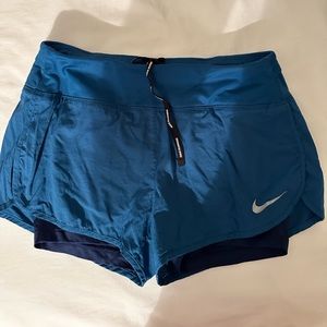 Blue Nike running shorts, size S, incredibly comfortable